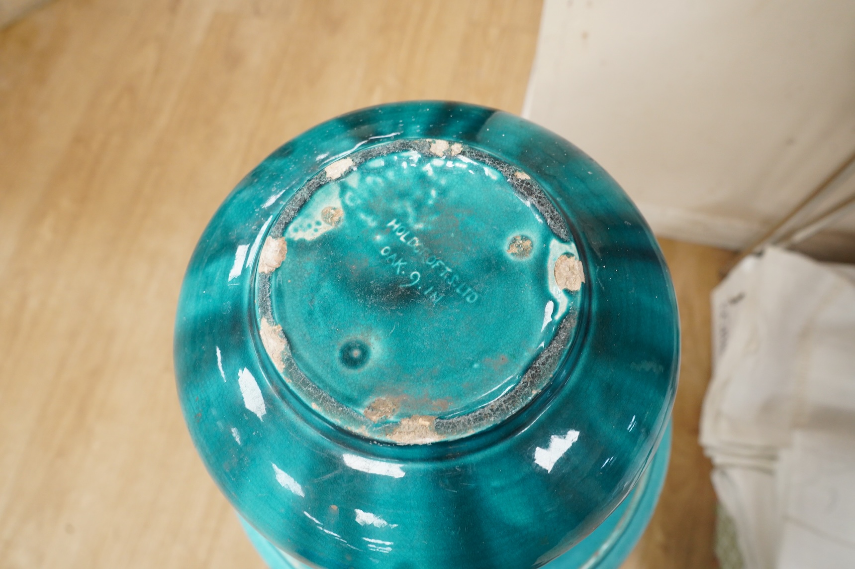 A Burmantofts style turquoise glazed jardiniere and a similar larger stand, decorated in relief, 90cm high